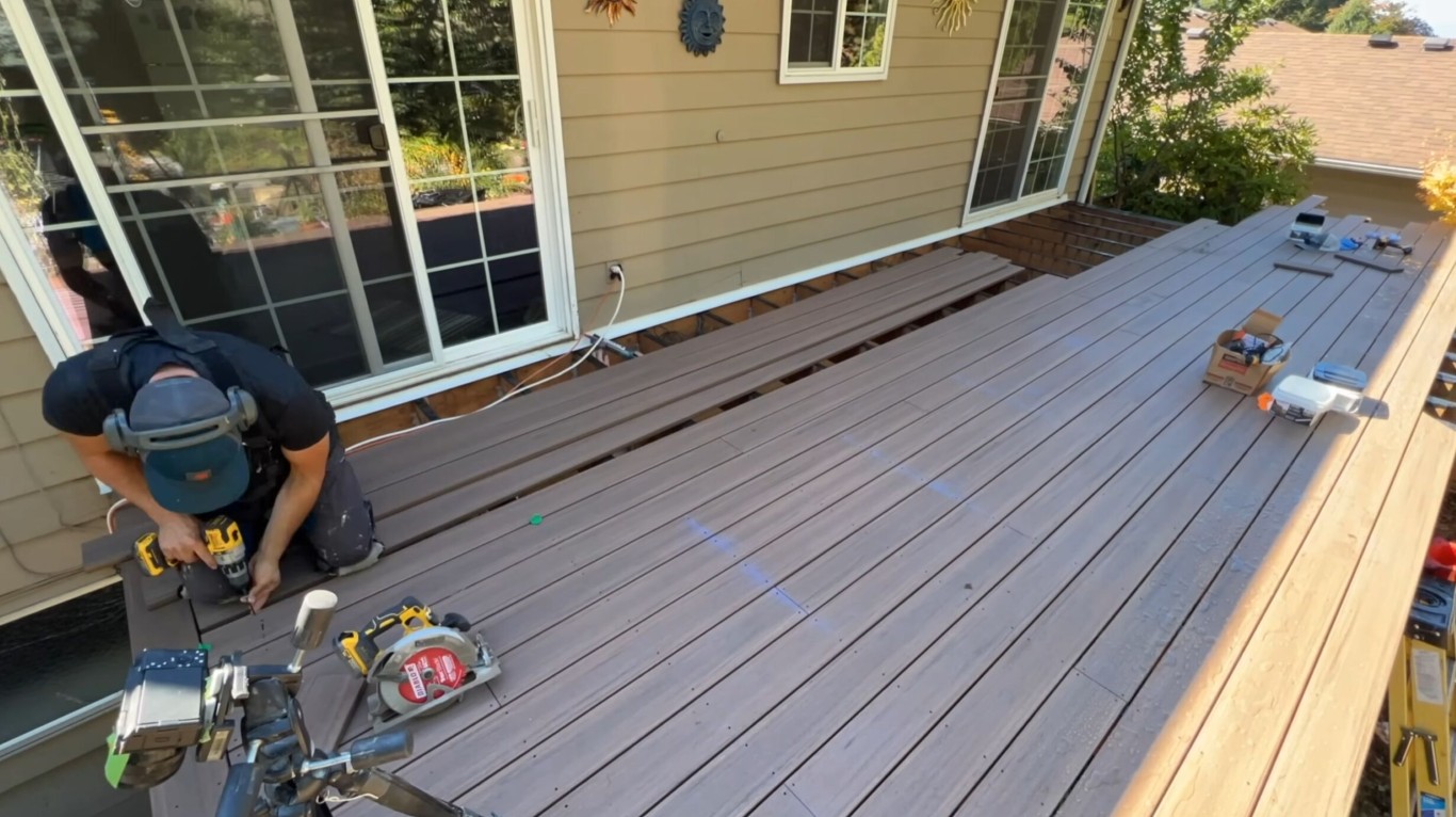 Professional deck builder installing composite decking in Oxnard, CA